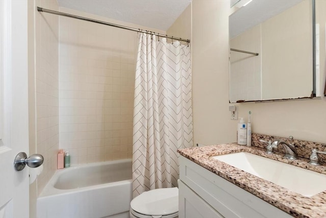 full bathroom with shower / bath combo, vanity, a textured ceiling, and toilet