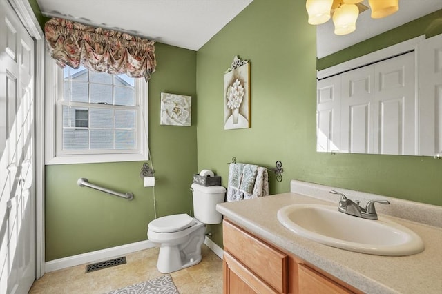 bathroom with tile patterned flooring, visible vents, vanity, toilet, and baseboards