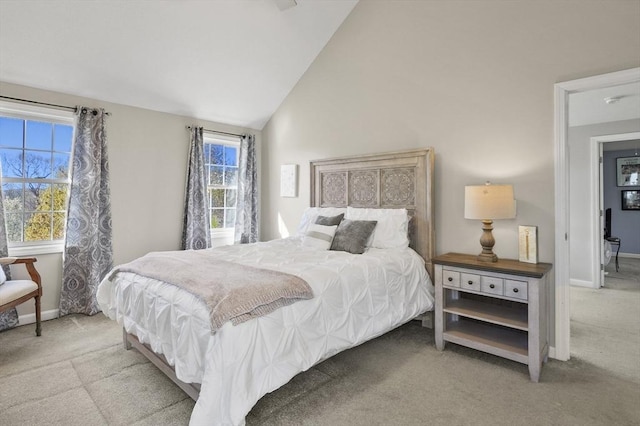 bedroom featuring carpet flooring, baseboards, and vaulted ceiling