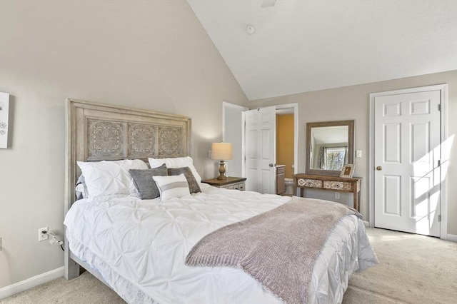 bedroom featuring baseboards, vaulted ceiling, and light carpet