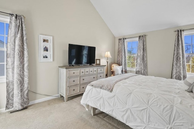 bedroom with baseboards, multiple windows, light carpet, and visible vents