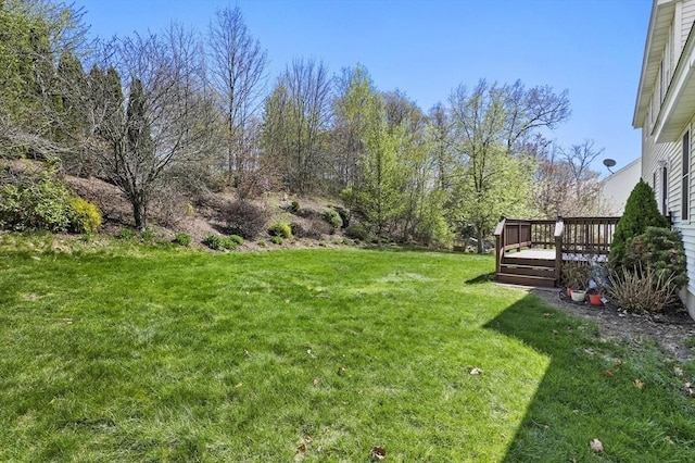 view of yard with a wooden deck