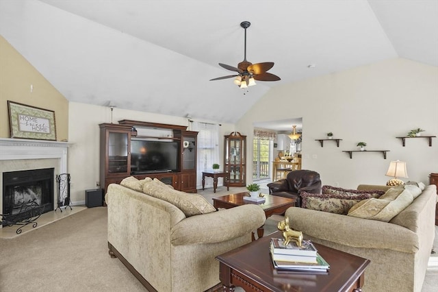 carpeted living room featuring a fireplace with flush hearth, ceiling fan, and vaulted ceiling