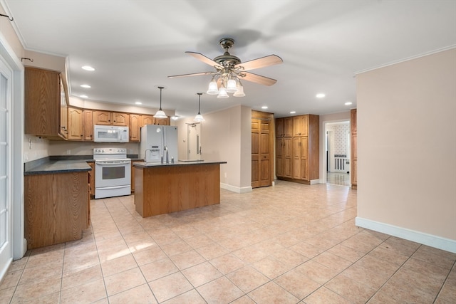 kitchen featuring light tile patterned floors, a center island, ceiling fan, and white appliances