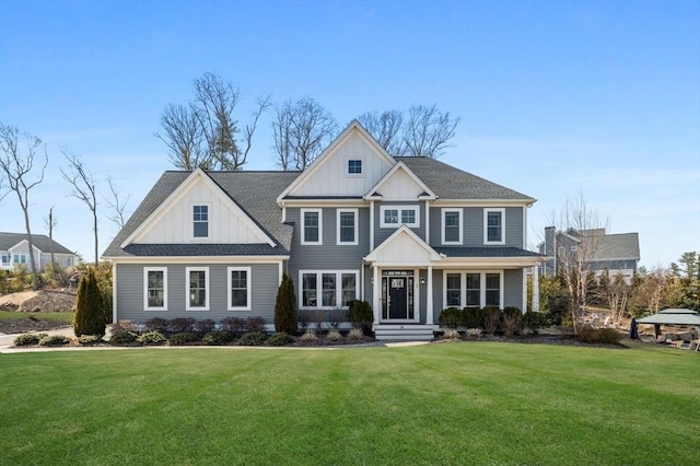 view of front of home featuring a gazebo, board and batten siding, and a front lawn