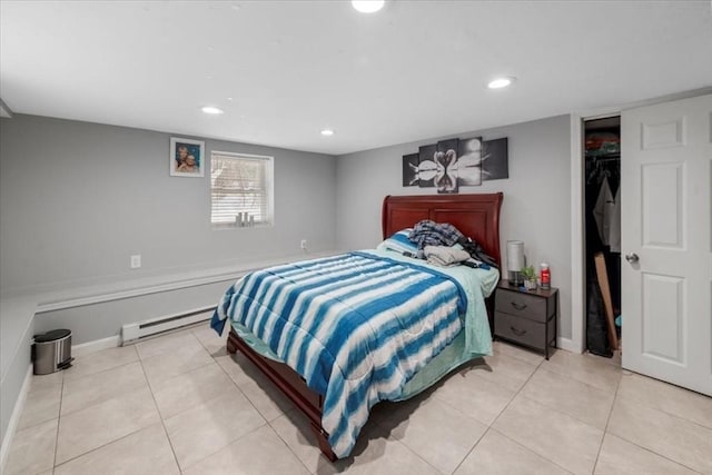 tiled bedroom featuring a baseboard radiator