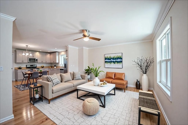 27 Williams St Unit 27, Methuen, MA 01844 - living area featuring light wood-type flooring, baseboards, ceiling fan, recessed lighting, and crown molding