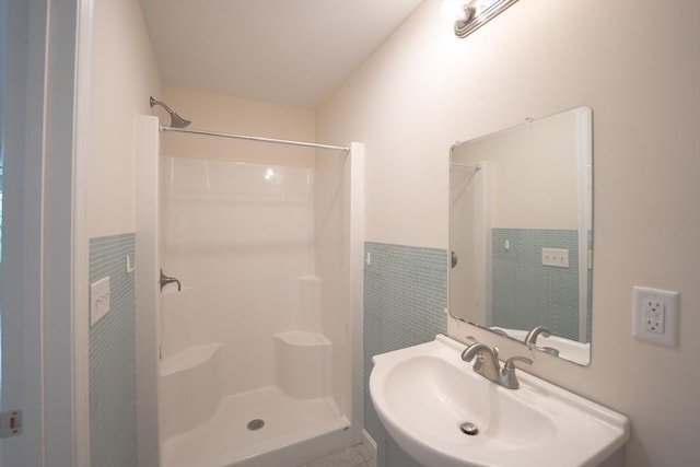 27 Williams St Unit 27, Methuen, MA 01844 - bathroom featuring tile walls, a shower, wainscoting, and vanity