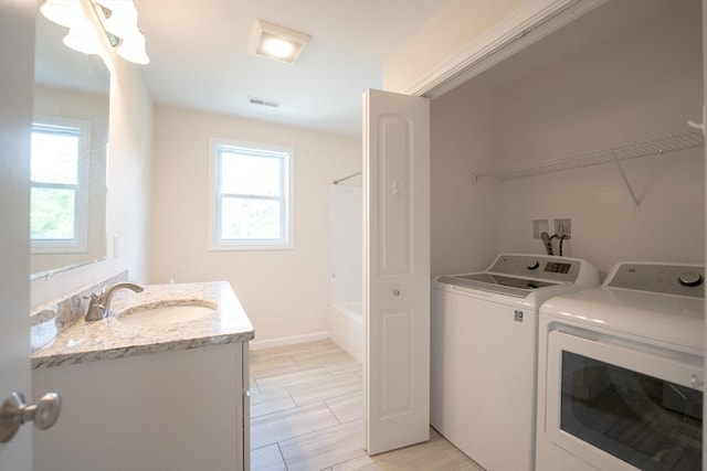 27 Williams St Unit 27, Methuen, MA 01844 - laundry area featuring separate washer and dryer and baseboards
