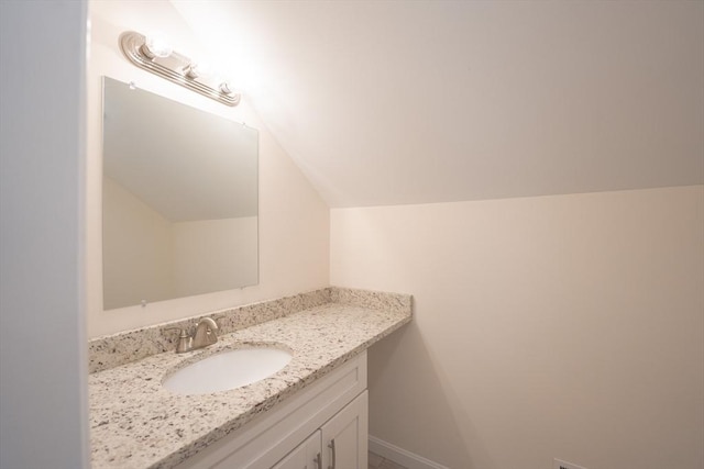 27 Williams St Unit 27, Methuen, MA 01844 - bathroom featuring vanity, vaulted ceiling, and baseboards