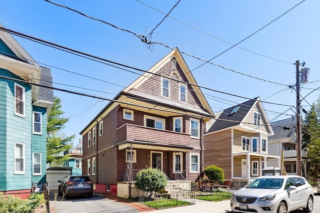 american foursquare style home featuring fence private yard