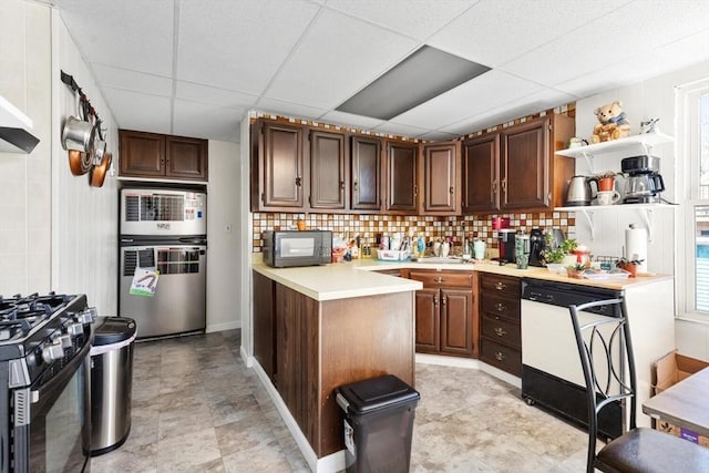 kitchen with open shelves, black microwave, a drop ceiling, dishwasher, and gas stove