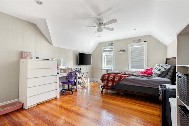 bedroom with light wood finished floors, ceiling fan, and lofted ceiling