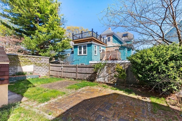 back of house featuring fence