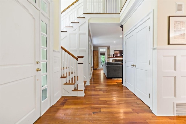 218 Pine St, Rehoboth, MA 02769 - foyer entrance with stairway, a decorative wall, wood finished floors, recessed lighting, and crown molding