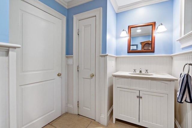 218 Pine St, Rehoboth, MA 02769 - bathroom featuring a wainscoted wall, vanity, crown molding, and tile patterned flooring