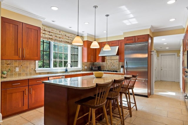 218 Pine St, Rehoboth, MA 02769 - kitchen with appliances with stainless steel finishes, extractor fan, light stone countertops, a kitchen island, and crown molding
