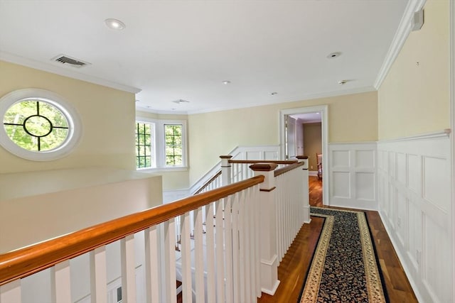 218 Pine St, Rehoboth, MA 02769 - hallway with an upstairs landing, dark wood-style floors, ornamental molding, a wainscoted wall, and a decorative wall