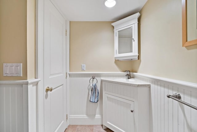 218 Pine St, Rehoboth, MA 02769 - bathroom with wainscoting, a decorative wall, and vanity