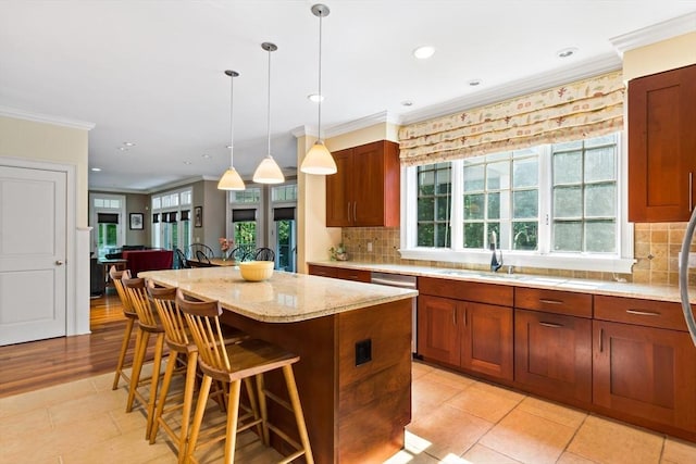 218 Pine St, Rehoboth, MA 02769 - kitchen with a sink, crown molding, a kitchen breakfast bar, dishwasher, and a center island