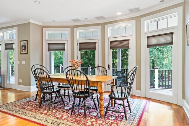 218 Pine St, Rehoboth, MA 02769 - dining area with crown molding, healthy amount of natural light, light wood finished floors, baseboards, and recessed lighting