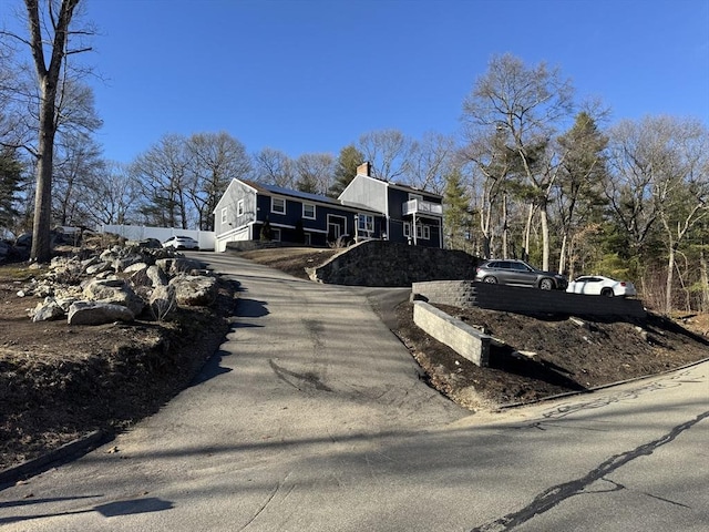 view of street featuring aphalt driveway