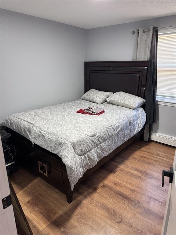 bedroom with wood finished floors