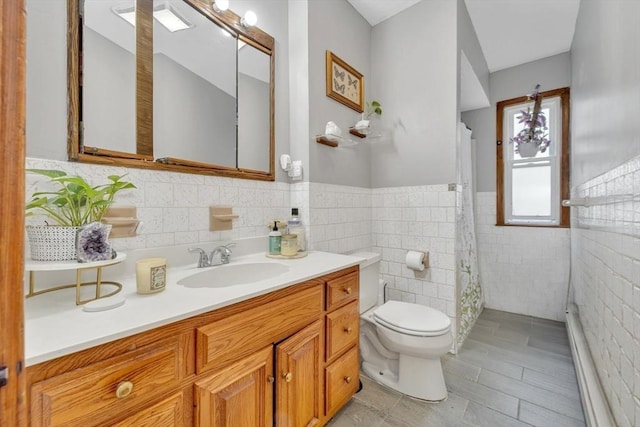 14 Halmstad, Worcester, MA 01607 - bathroom featuring toilet, vanity, tile walls, a shower with curtain, and wainscoting