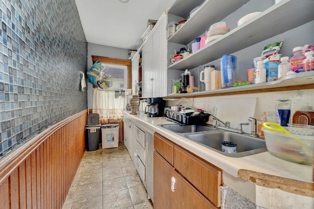14 Halmstad, Worcester, MA 01607 - kitchen with stone tile flooring, a sink, light countertops, open shelves, and a wainscoted wall