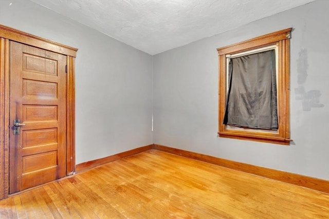 14 Halmstad, Worcester, MA 01607 - spare room with light wood-style floors, baseboards, and a textured ceiling