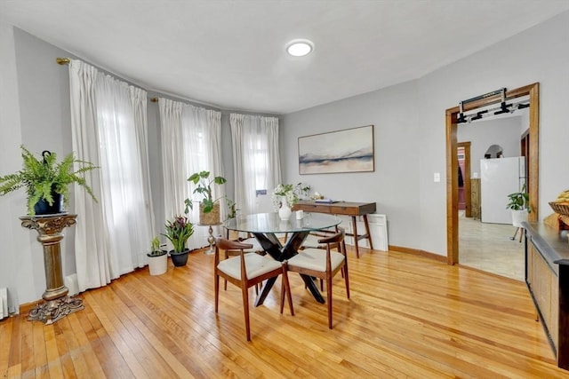 14 Halmstad, Worcester, MA 01607 - dining room featuring a barn door and light wood-style flooring
