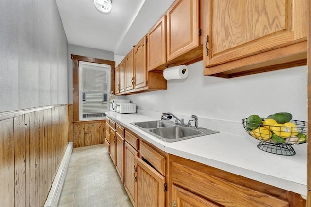 14 Halmstad, Worcester, MA 01607 - kitchen featuring a sink, wooden walls, light countertops, and wainscoting