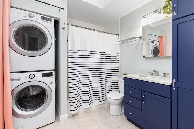 clothes washing area with light tile patterned flooring, laundry area, stacked washer / dryer, and a sink