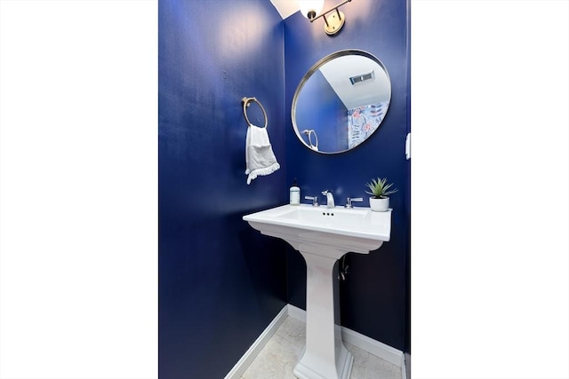 bathroom with tile patterned floors, visible vents, and baseboards