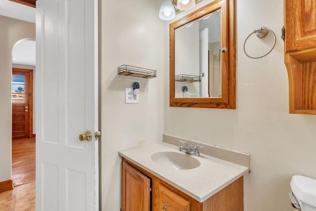 bathroom featuring vanity and toilet