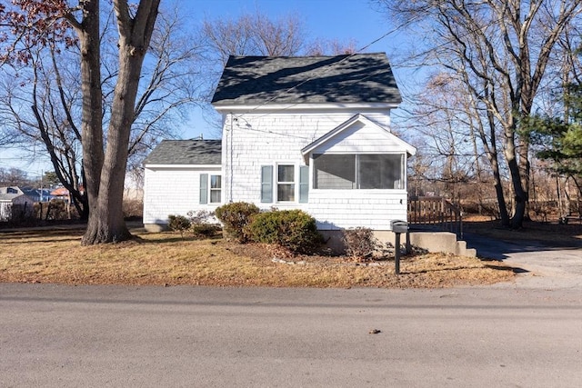 view of front of house featuring a sunroom