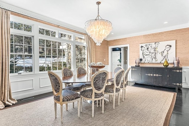 dining area featuring plenty of natural light, visible vents, and crown molding