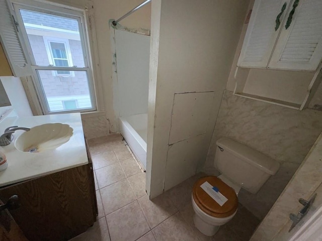 full bathroom featuring tile patterned flooring, shower / bath combination, vanity, and toilet