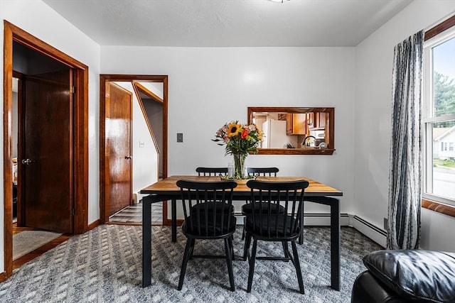 dining room featuring baseboards