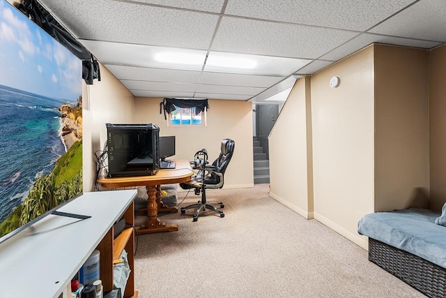 carpeted office space featuring a paneled ceiling, baseboards, and a water view