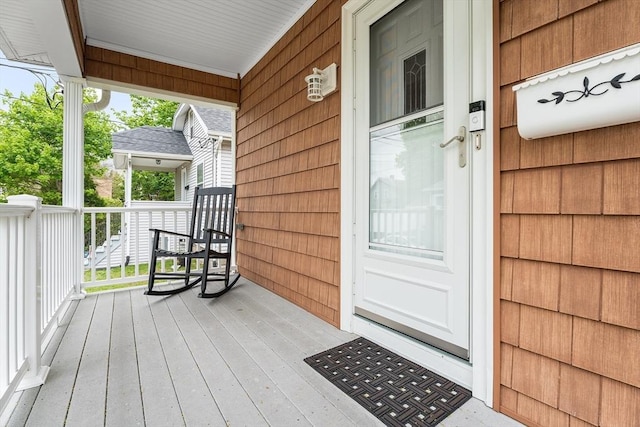 entrance to property featuring a porch