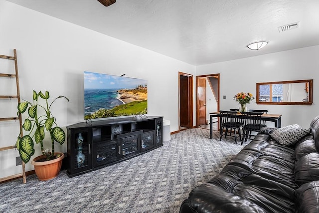 carpeted living room with baseboards