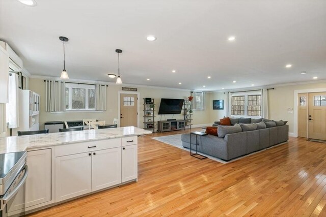 38 Rocky Hill Rd Unit B, Amesbury, MA 01913 - living room featuring recessed lighting, ornamental molding, light wood-type flooring, and baseboards