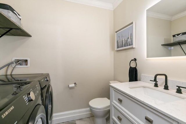 38 Rocky Hill Rd Unit B, Amesbury, MA 01913 - half bath featuring washing machine and clothes dryer, marble look tile flooring, crown molding, toilet, and vanity