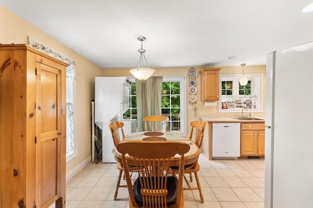 37 Railroad Ave, Whitman, MA 02382 - dining room featuring light tile patterned floors and baseboards