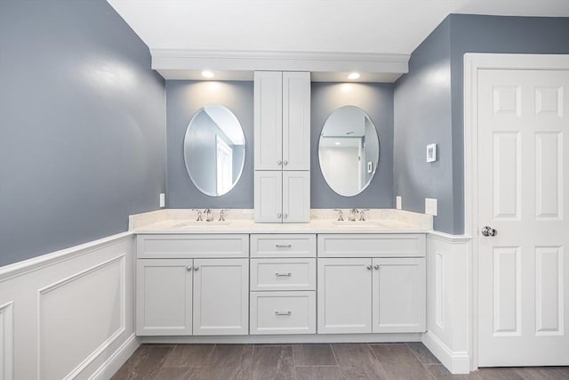 3 Emerson Way, Hopkinton, MA 01748 - bathroom featuring wainscoting, double vanity, and a decorative wall