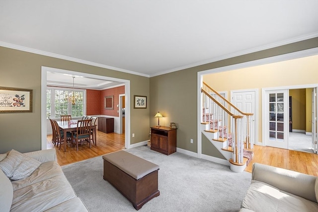 3 Emerson Way, Hopkinton, MA 01748 - living room featuring ornamental molding, stairs, a chandelier, baseboards, and light wood-type flooring