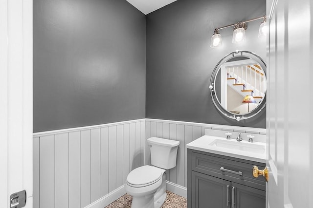 3 Emerson Way, Hopkinton, MA 01748 - bathroom featuring toilet, vanity, and wainscoting