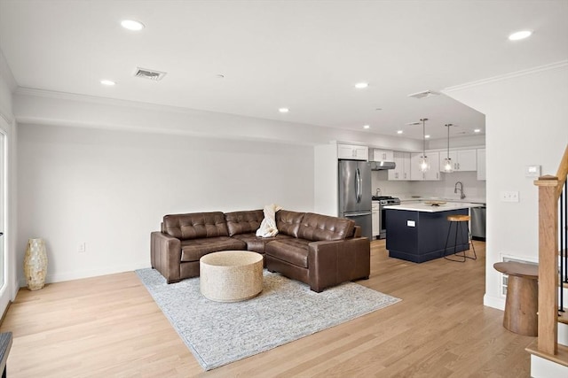 50 N Payne St Unit 2, Quincy, MA 02169 - living room with recessed lighting, light wood-style flooring, ornamental molding, and baseboards
