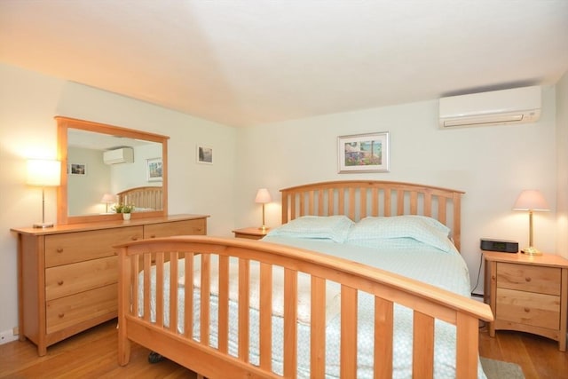 13 N Grove St, Foxboro, MA 02035 - bedroom with a wall unit AC and wood finished floors